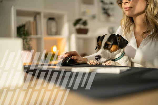 woman and her dog at desk